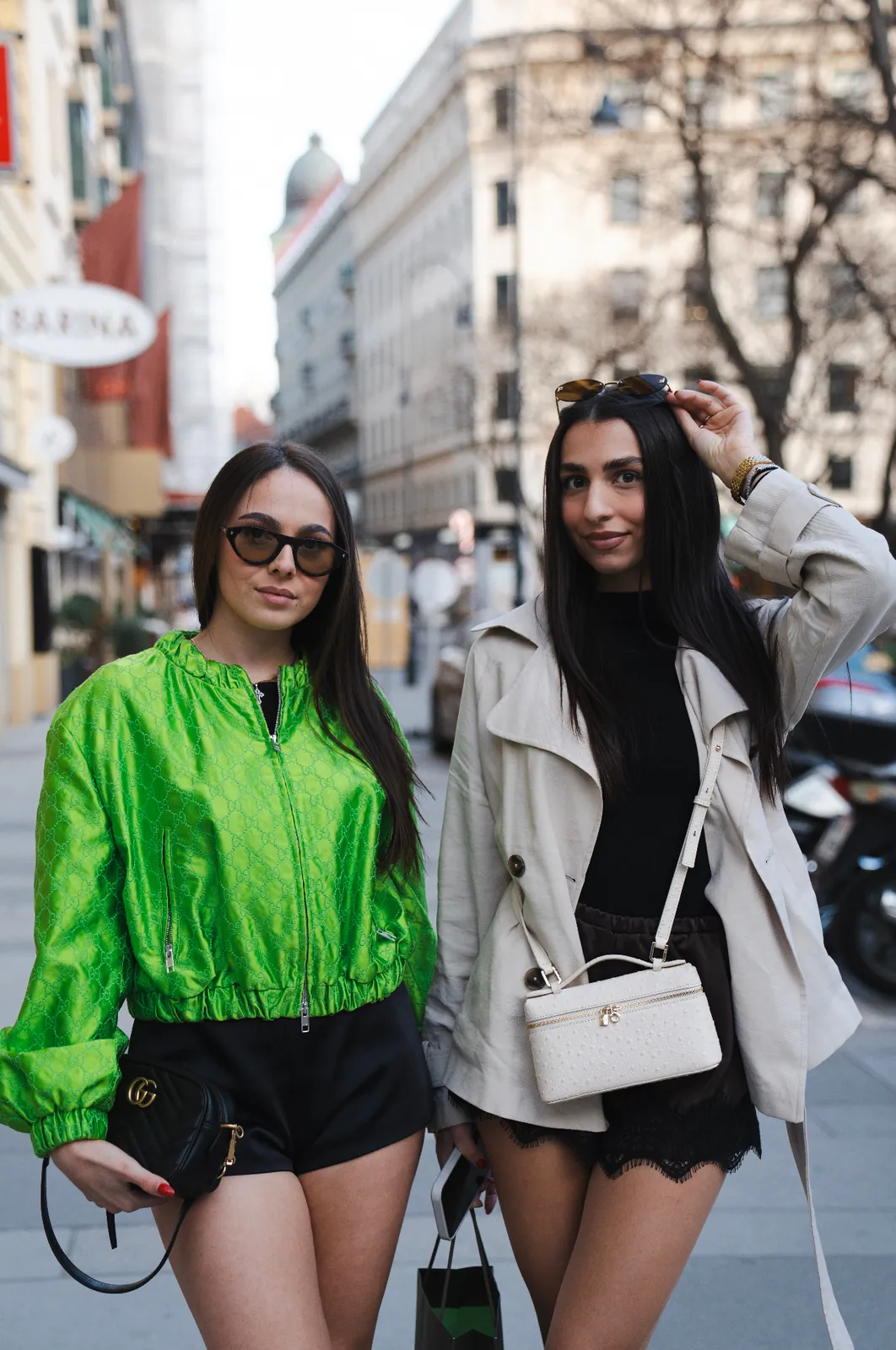 Two women in editorial street style on a Vienna boulevard